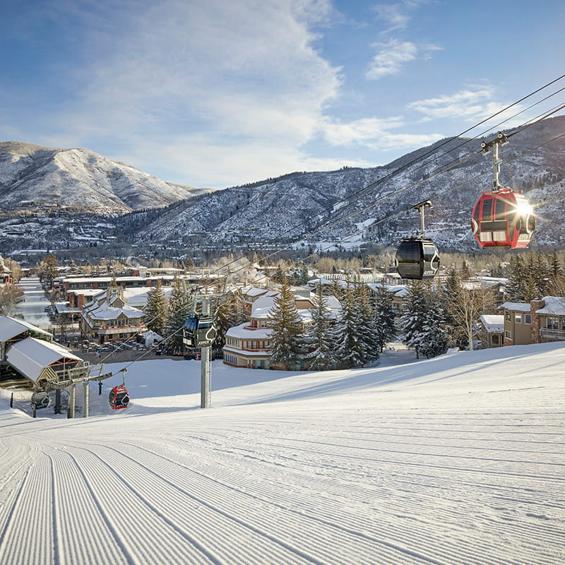 aspen mountain slopes with gondola in front of hotel